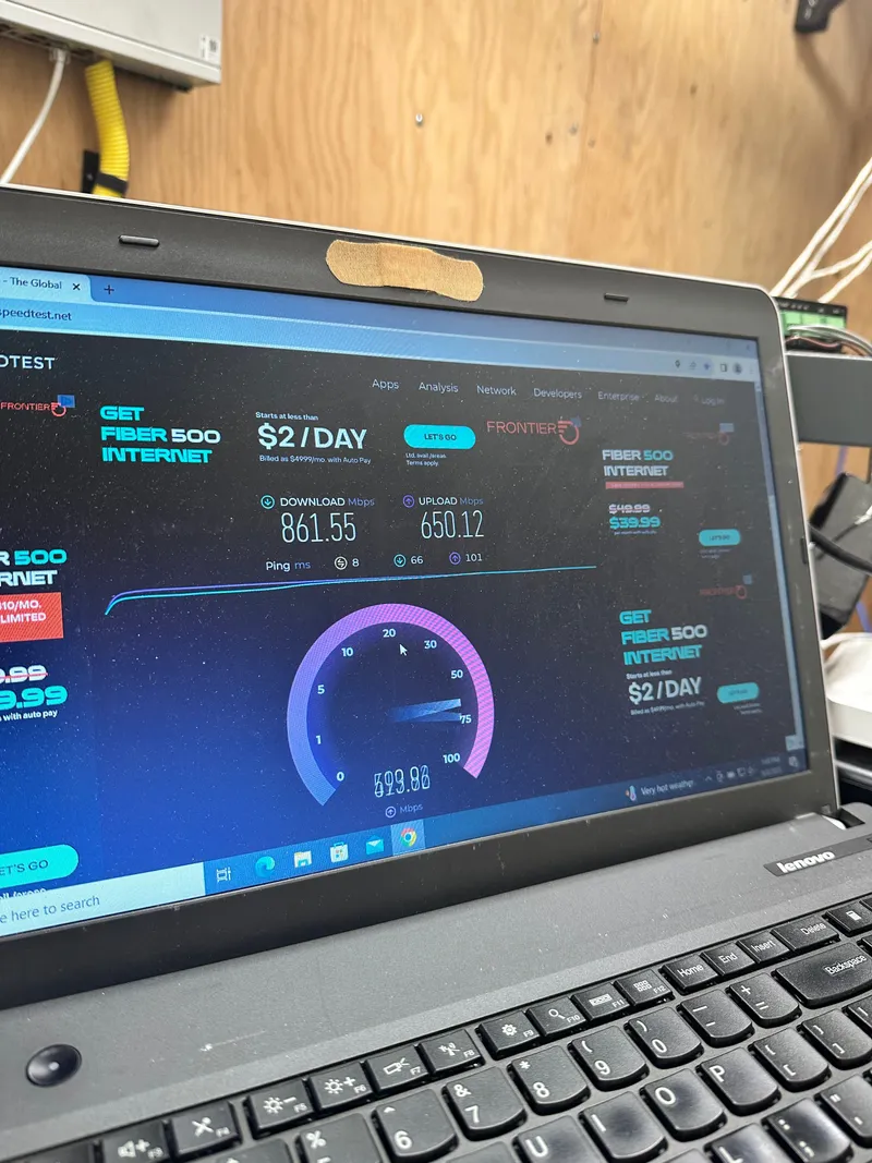 Completed internet speed test on a laptop verifying real download and upload speeds