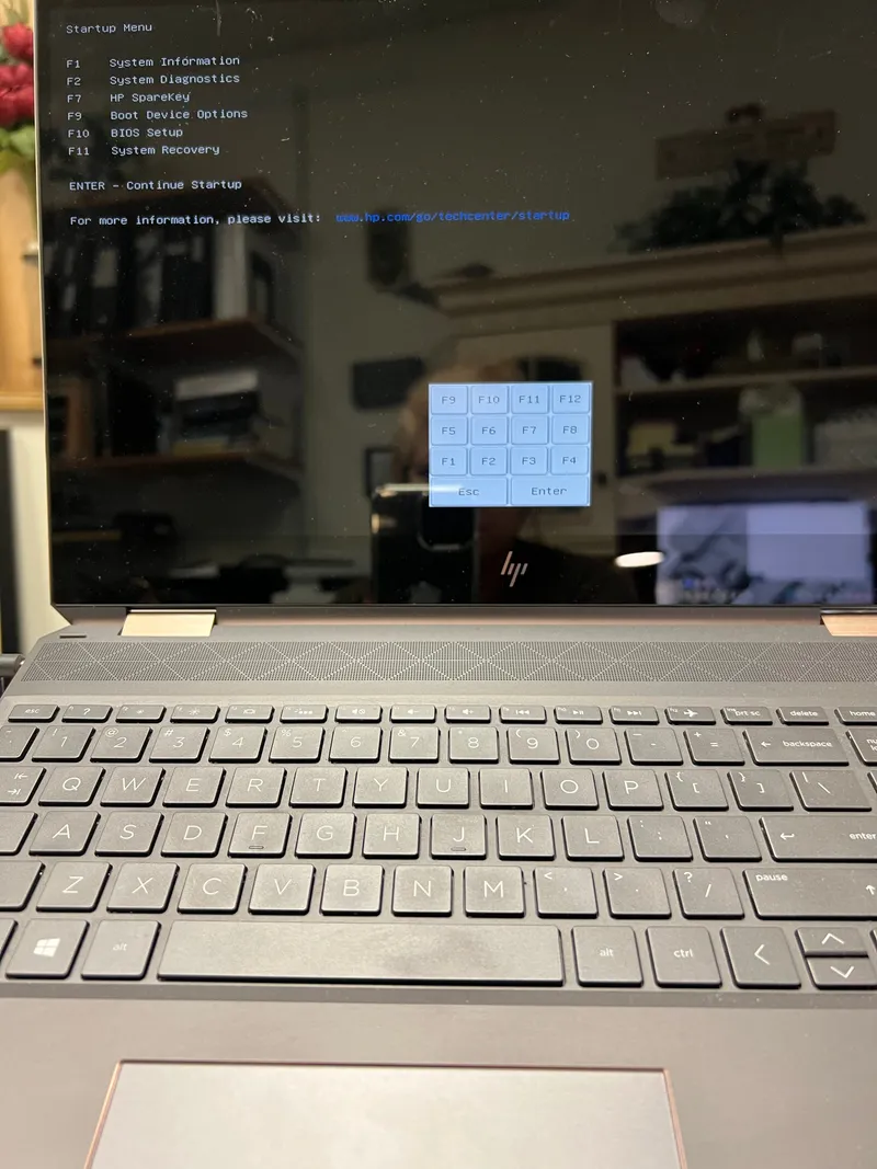 Laptop displaying its startup and recovery menu during an in-home computer repair