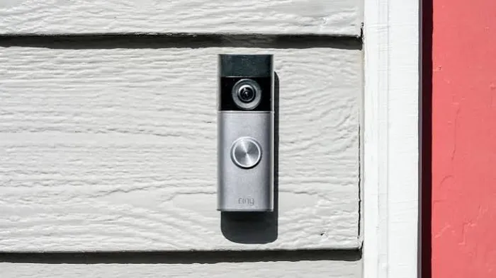 Wireless video doorbell mounted beside a front door with no existing wiring needed